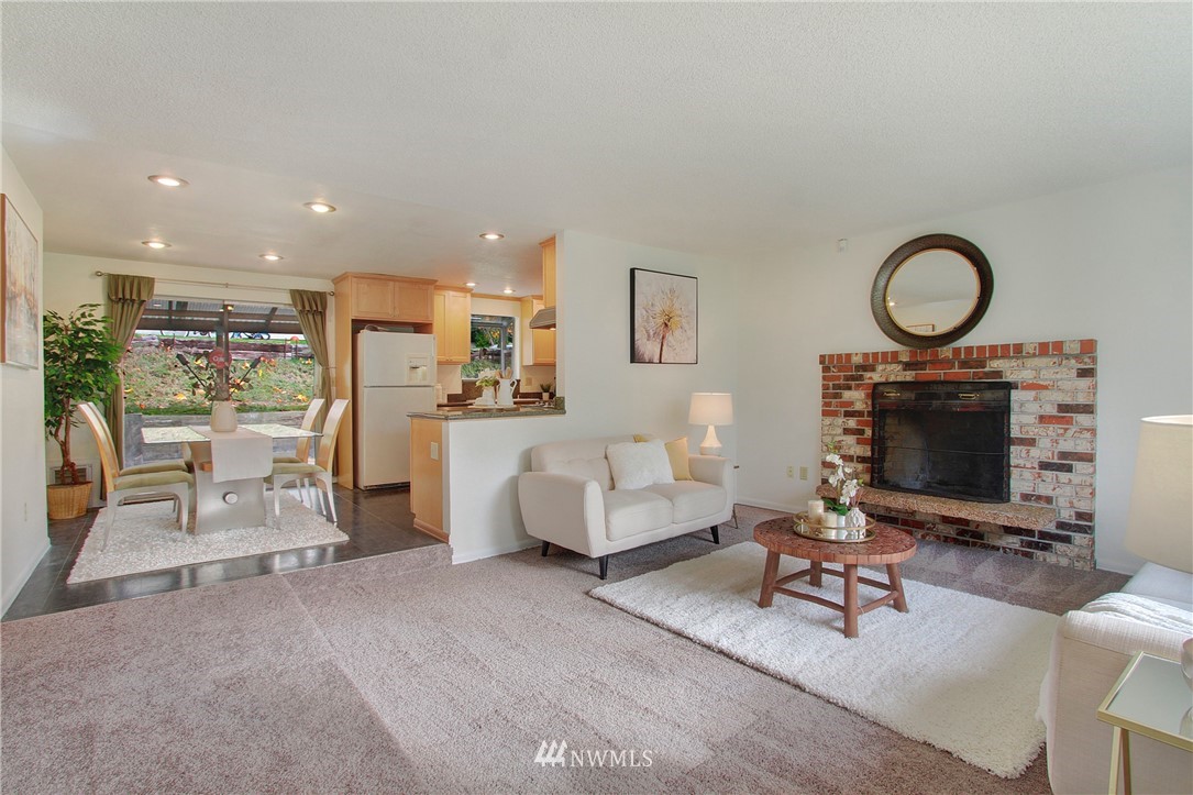 1813 Aberdeen Avenue Southeast Renton, WA 98055 - Photo 7 of 22 a living room with furniture a fireplace and a flat screen tv