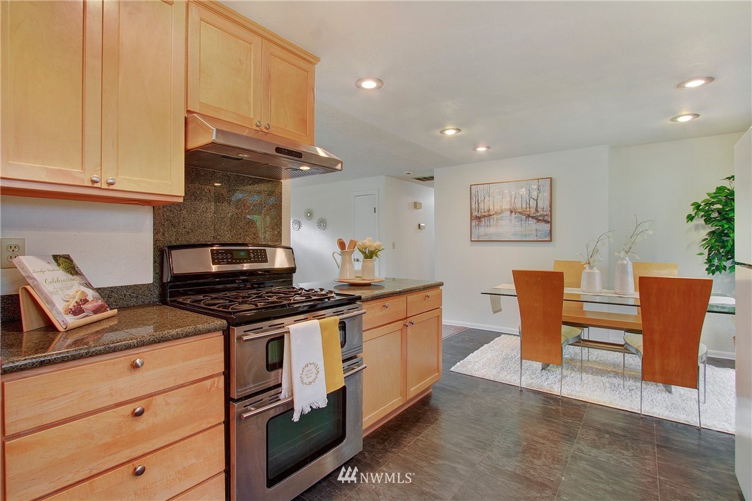 1813 Aberdeen Avenue Southeast Renton, WA 98055 - Photo 9 of 22 a kitchen with stainless steel appliances granite countertop a stove and a sink