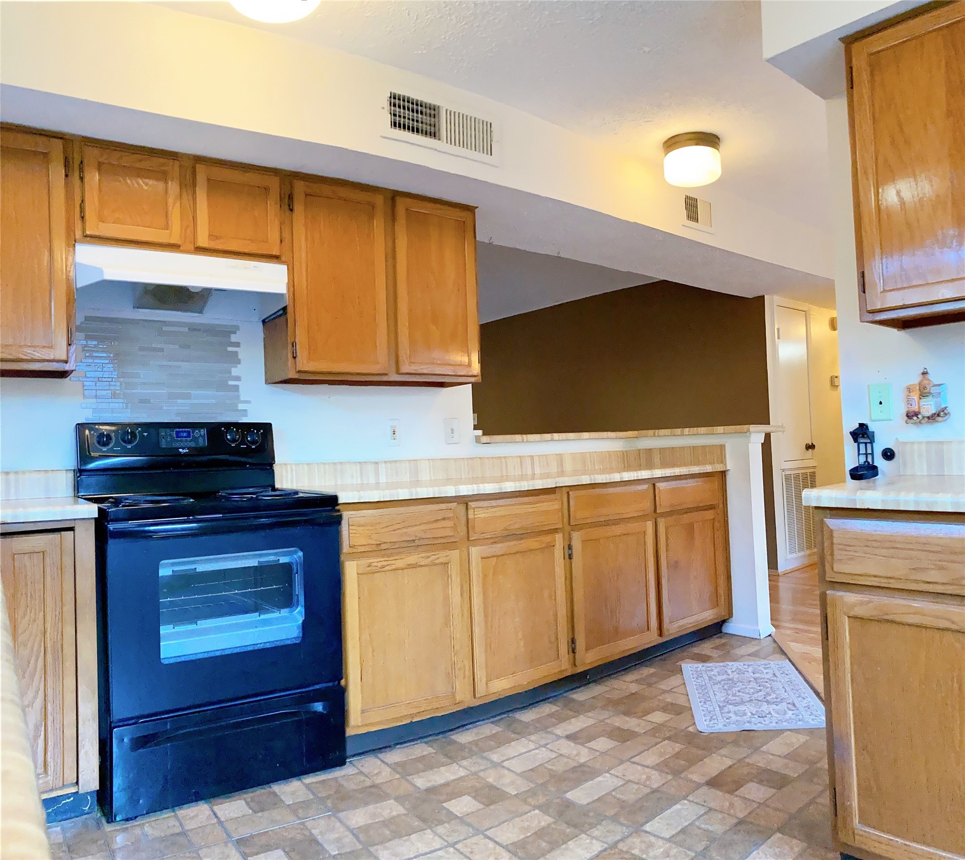 19518 Munsey Court Katy, TX 77449 - Photo 12 of 45 a kitchen with stainless steel appliances granite countertop a stove a sink and a microwave