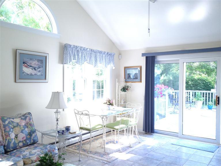 54 Ansel Howland Road Centerville, MA 02632 - Photo 6 of 19 a living room with furniture and large windows