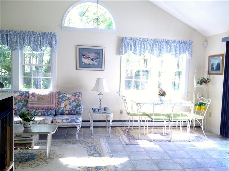 54 Ansel Howland Road Centerville, MA 02632 - Photo 7 of 19 a living room with furniture and a large window