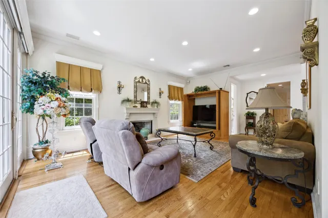a living room with fireplace furniture and a flat screen tv