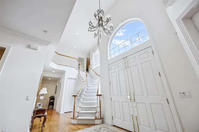 a view of a livingroom with furniture and stairs