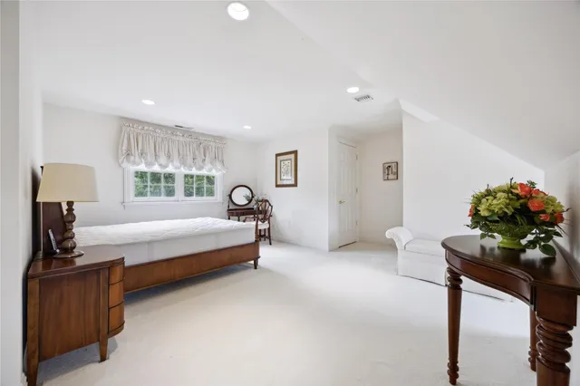 a bathroom with a sink toilet and mirror