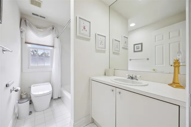 a bedroom with a bed and a table