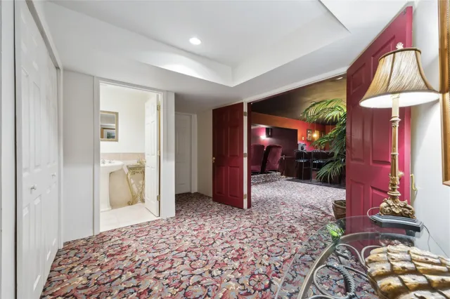 a bathroom with a sink toilet and a mirror