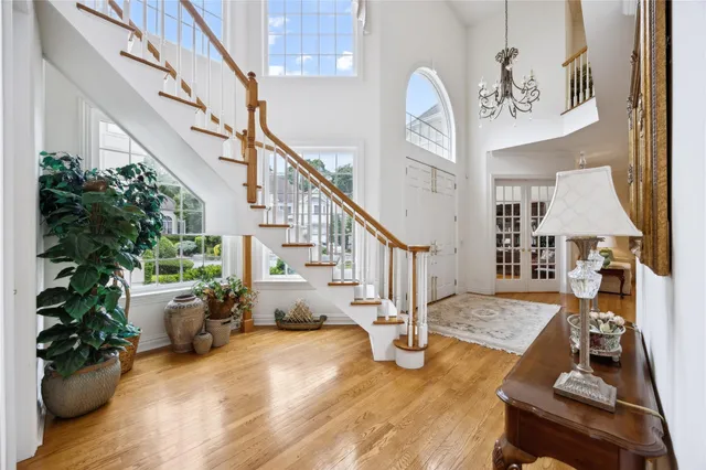 a view of entryway and hall with wooden floor