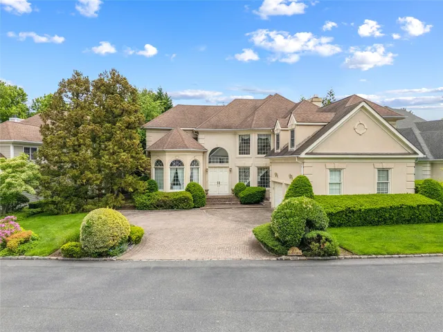 a view of a house with a yard porch and sitting area