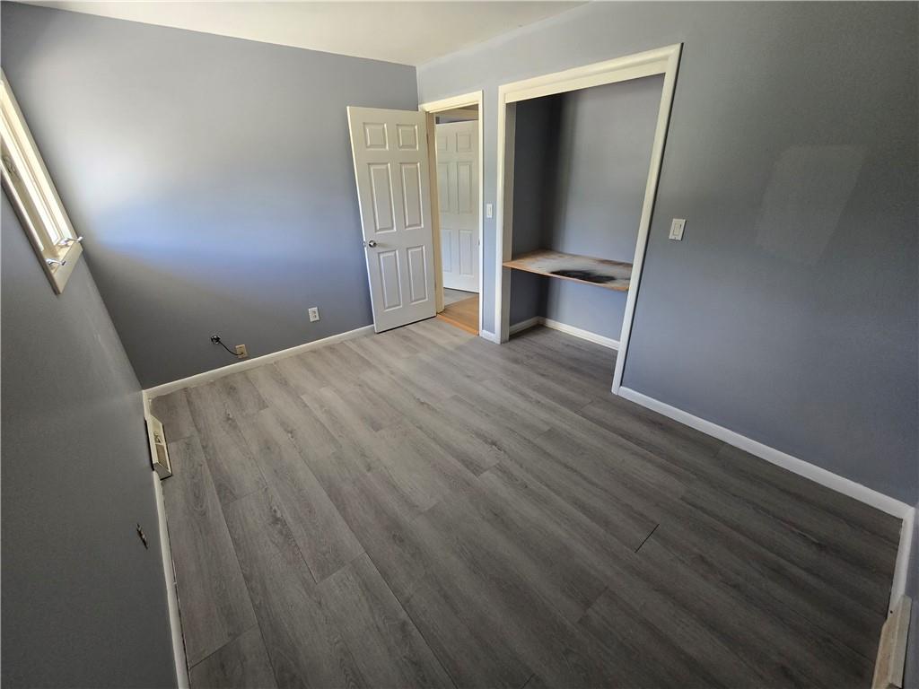 740 South Keel Ridge Road Hermitage, PA 16148 - Photo 12 of 33 a view of an empty room with wooden floor and a window