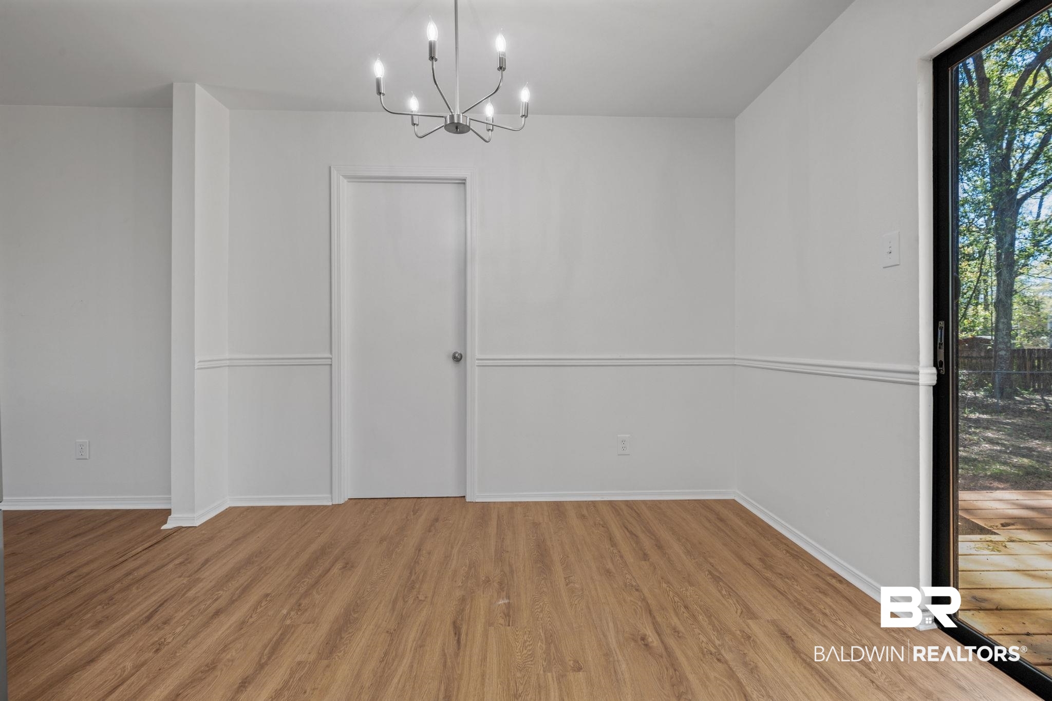 5734 Pheasant Court Theodore, AL 36582 - Photo 9 of 23 Unfurnished dining area with hanging lights and light wood-type flooring