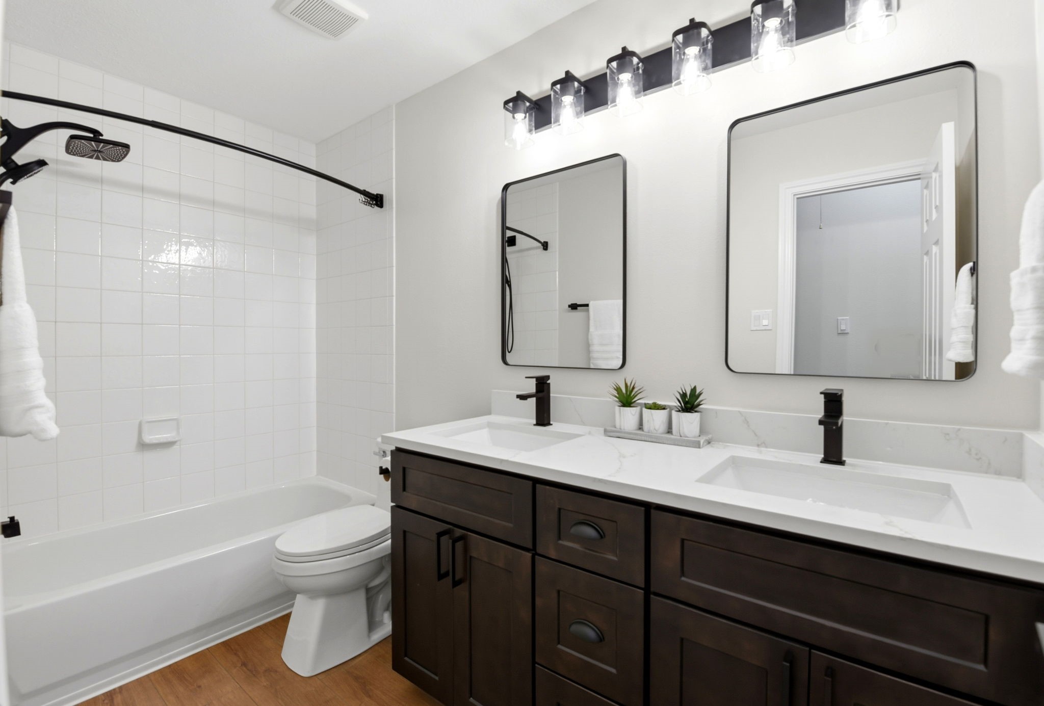 29819 South Legends Village Circle Spring, TX 77386 - Photo 33 of 48 a bathroom with a double vanity sink mirror and toilet