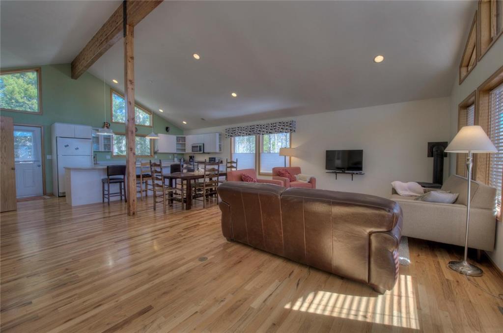 47 Spring Beauty Drive Silverthorne, CO 80498 - Photo 2 of 23 a living room with furniture and a wooden floor