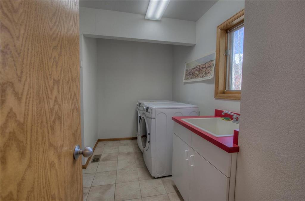 47 Spring Beauty Drive Silverthorne, CO 80498 - Photo 12 of 23 a utility room with dryer and washer