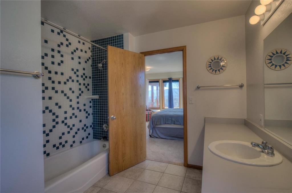 47 Spring Beauty Drive Silverthorne, CO 80498 - Photo 15 of 23 a bathroom with a bathtub and a shower