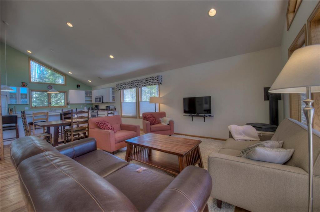 47 Spring Beauty Drive Silverthorne, CO 80498 - Photo 3 of 23 a living room with furniture and a flat screen tv