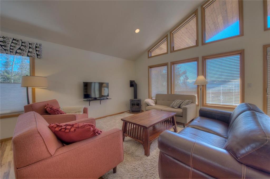47 Spring Beauty Drive Silverthorne, CO 80498 - Photo 4 of 23 a living room with furniture ceiling fan and a window