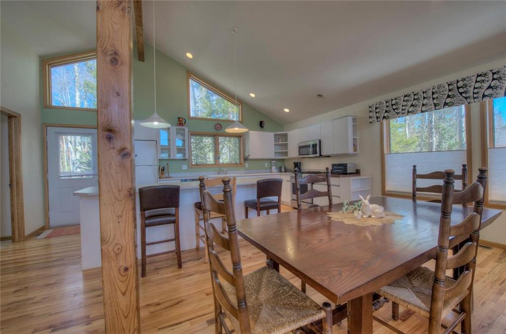 47 Spring Beauty Drive Silverthorne, CO 80498 - Photo 5 of 23 a dining room with furniture and wooden floor