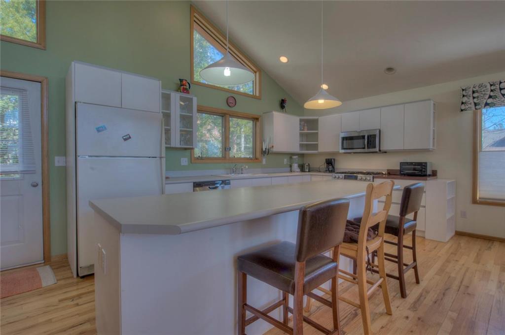 47 Spring Beauty Drive Silverthorne, CO 80498 - Photo 6 of 23 a kitchen with stainless steel appliances granite countertop a sink a stove a refrigerator and a microwave