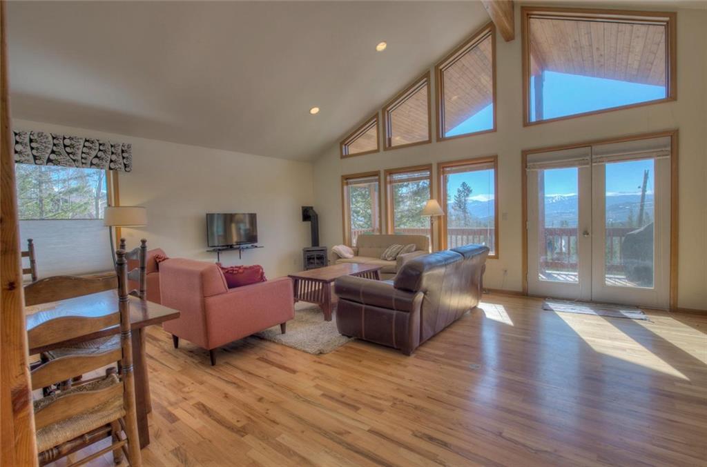 47 Spring Beauty Drive Silverthorne, CO 80498 - Photo 10 of 23 a living room with furniture fireplace and windows