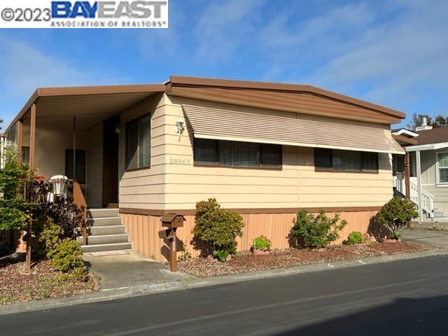 a view of a house with a street