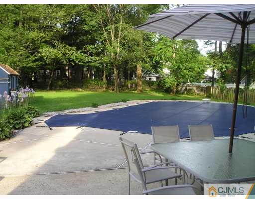 28 Hillsdale Road Edison, NJ 08820 - Photo 8 of 8 a view of a backyard with a patio