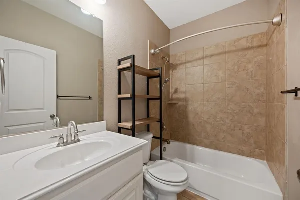 a view of walk in closet with wooden floor