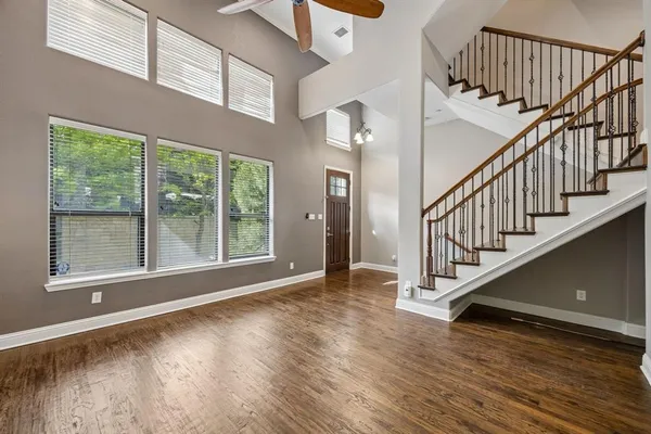 a view of an entryway with wooden floor