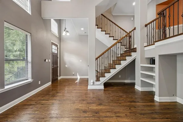 a view of staircase with white walls and windows