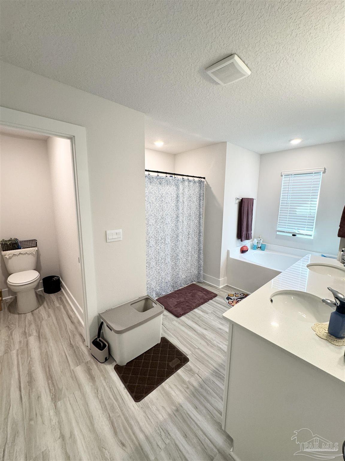3315 Garganey Road Pace, FL 32571 - Photo 20 of 52 a living room with a couch and a table