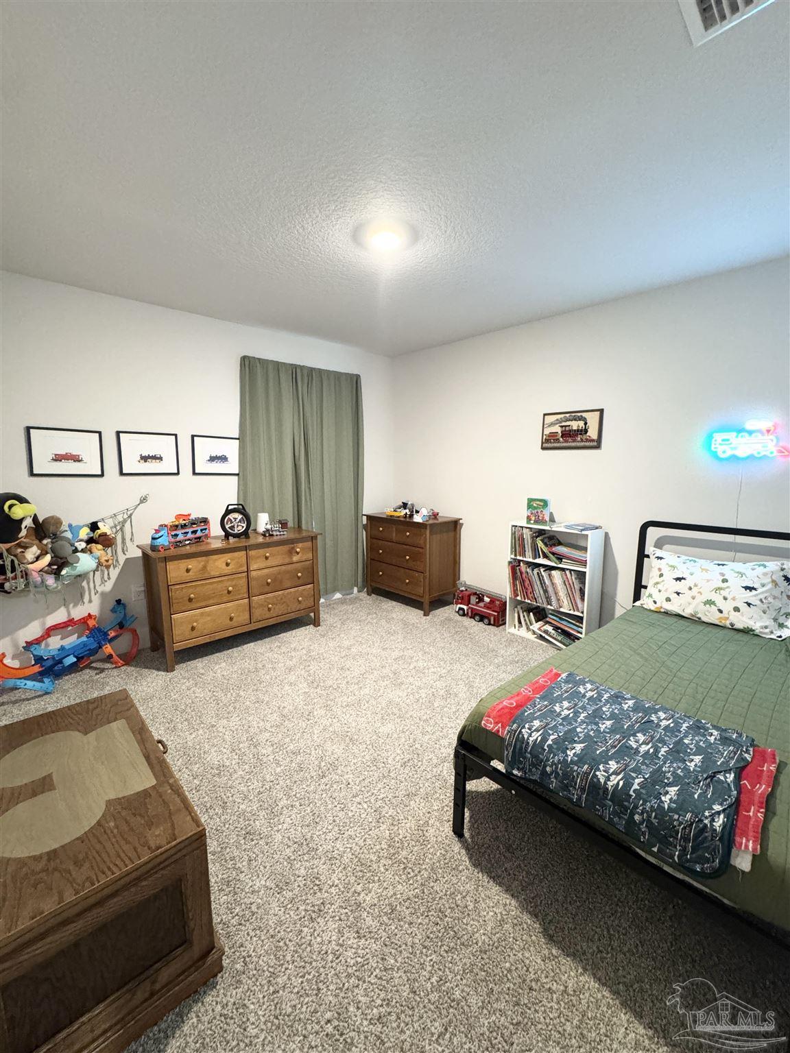 3315 Garganey Road Pace, FL 32571 - Photo 29 of 52 a bedroom with bed and window