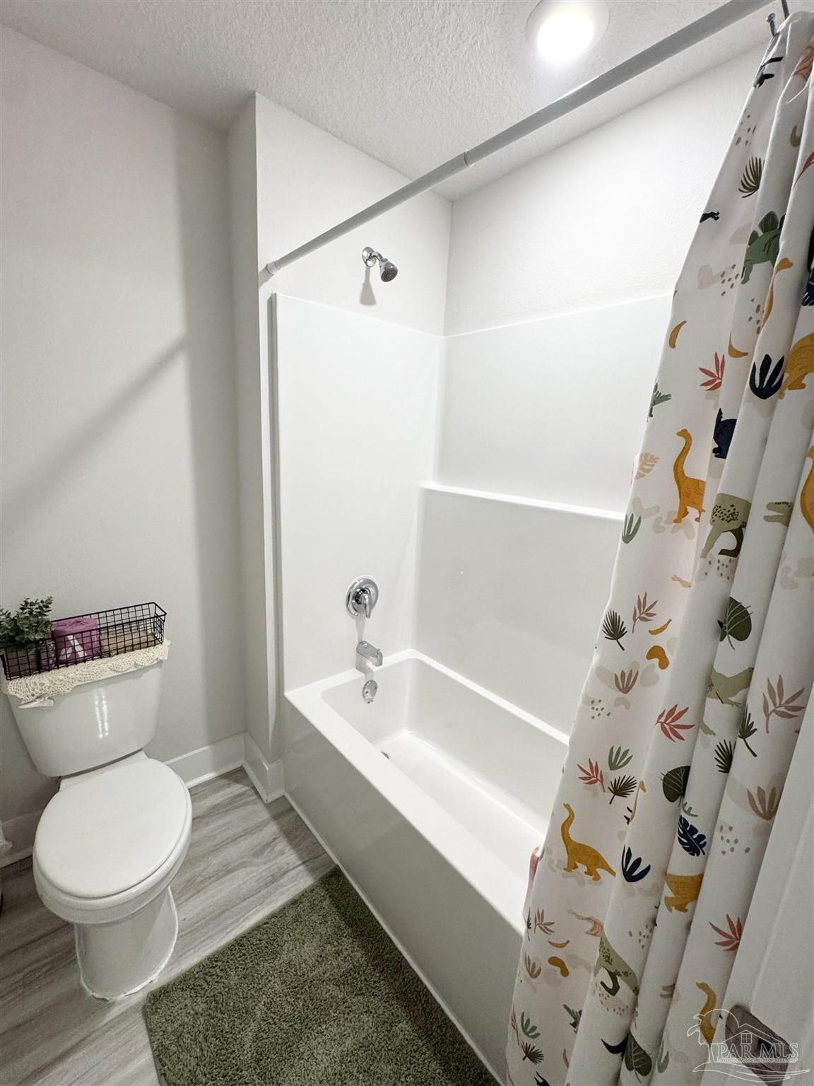 3315 Garganey Road Pace, FL 32571 - Photo 33 of 52 a bathroom with a toilet and a bathtub