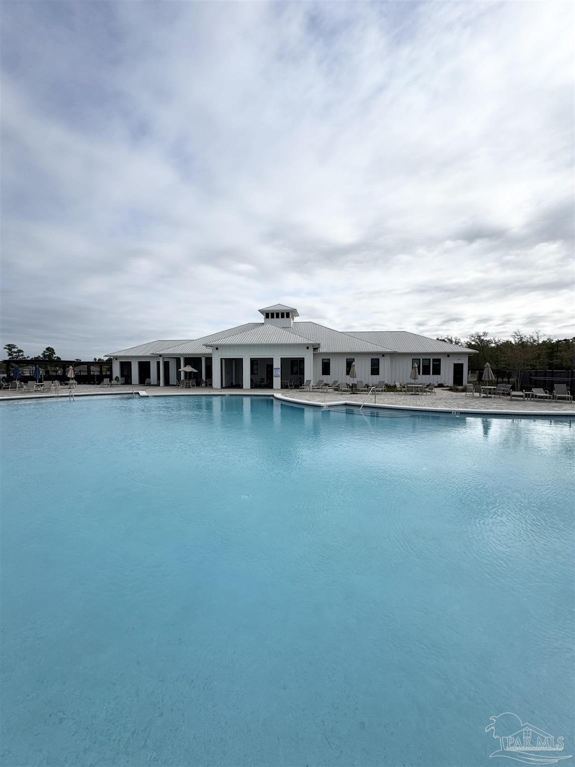 3315 Garganey Road Pace, FL 32571 - Photo 49 of 52 a view of building with lake view and mountain view