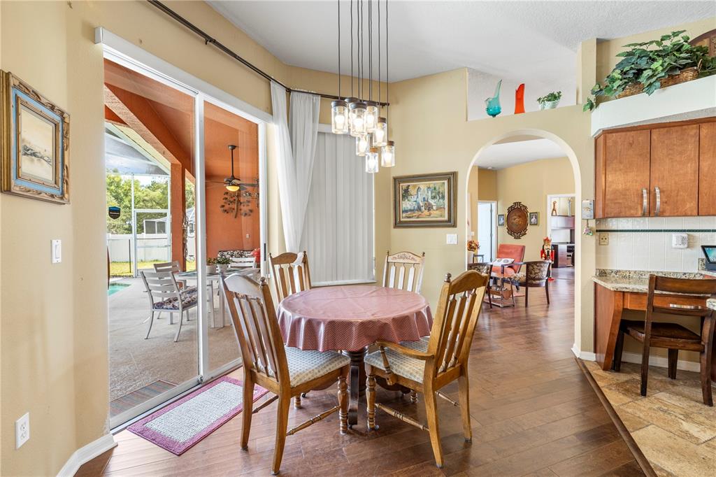 3051 Waterfall Drive Spring Hill, FL 34608 - Photo 15 of 74 a view of a dining room with furniture window and outside view