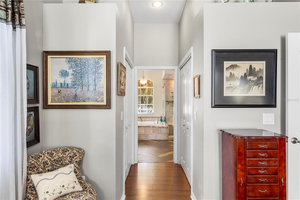3051 Waterfall Drive Spring Hill, FL 34608 - Photo 26 of 74 a view of a hallway with wooden floor and a bedroom