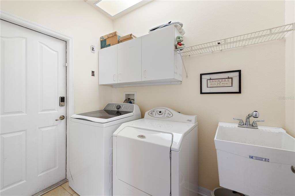 3051 Waterfall Drive Spring Hill, FL 34608 - Photo 29 of 74 a view of bathroom with a washer and dryer
