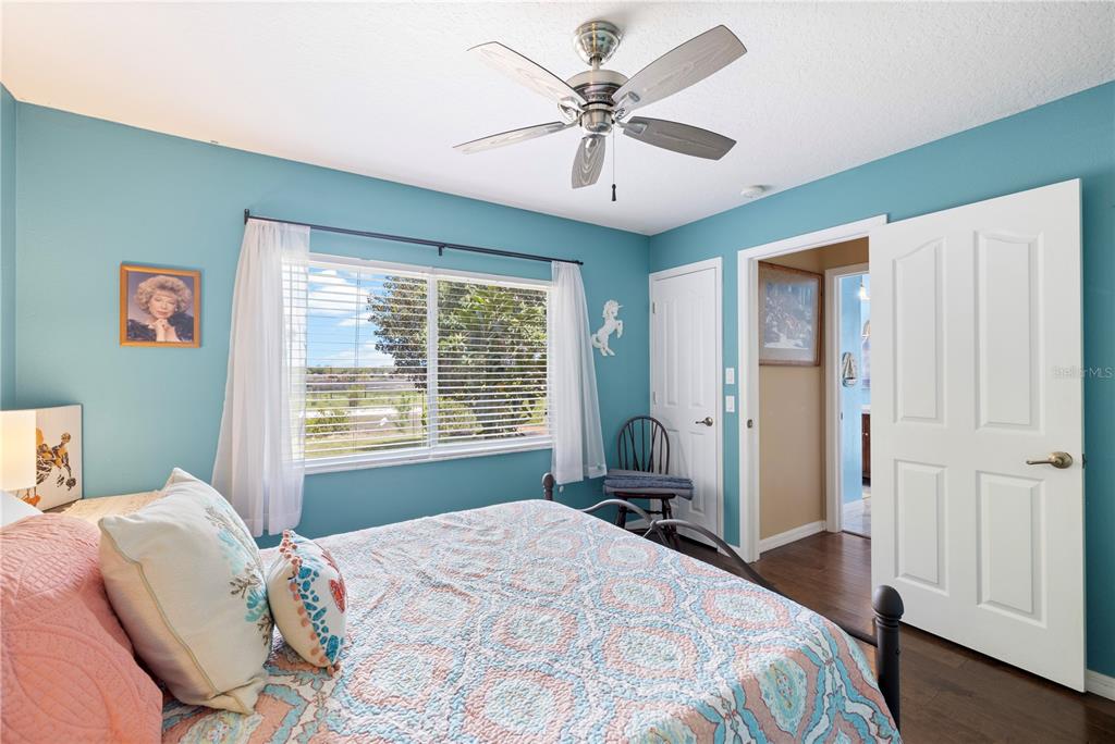3051 Waterfall Drive Spring Hill, FL 34608 - Photo 36 of 74 a bedroom with a large bed and a window
