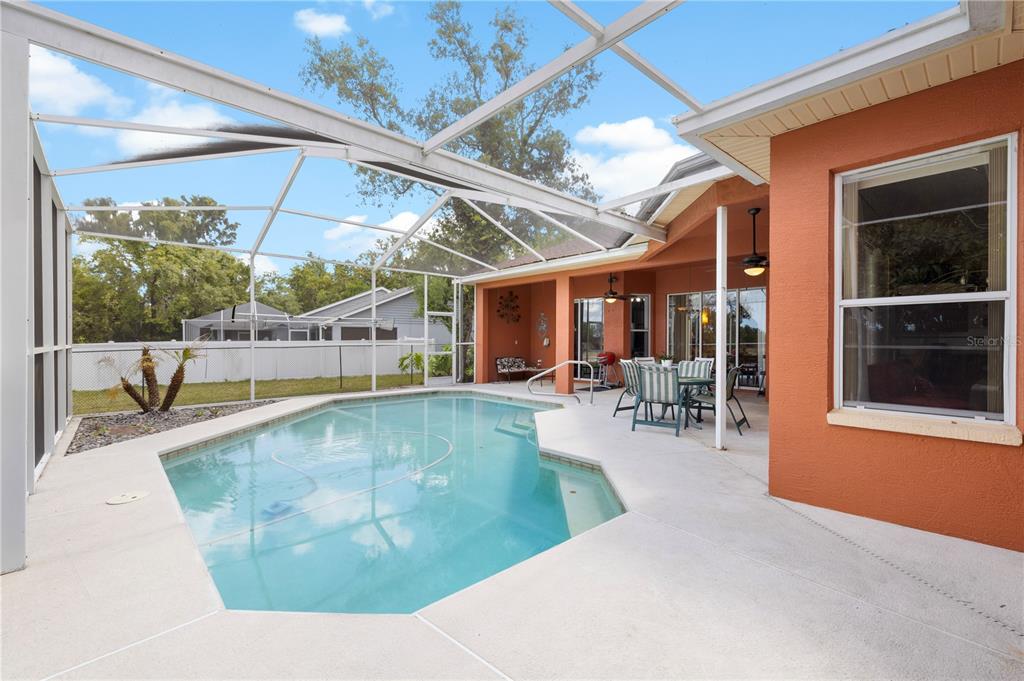 3051 Waterfall Drive Spring Hill, FL 34608 - Photo 46 of 74 a view of a swimming pool with a patio