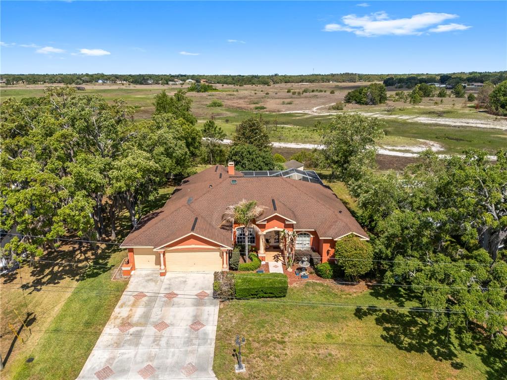 3051 Waterfall Drive Spring Hill, FL 34608 - Photo 53 of 74 an aerial view of a house with a lake view