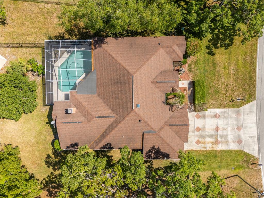 3051 Waterfall Drive Spring Hill, FL 34608 - Photo 57 of 74 an aerial view of a house with a yard and garden