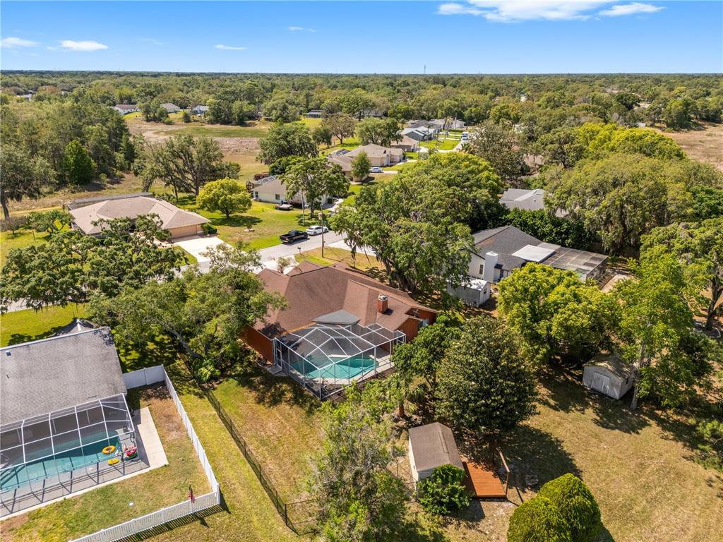 3051 Waterfall Drive Spring Hill, FL 34608 - Photo 67 of 74 an aerial view of residential houses with outdoor space