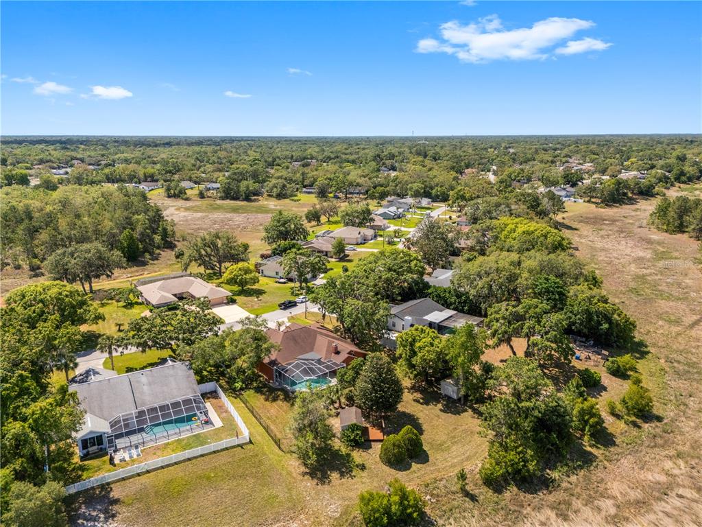 3051 Waterfall Drive Spring Hill, FL 34608 - Photo 68 of 74 an aerial view of residential houses with outdoor space and ocean view