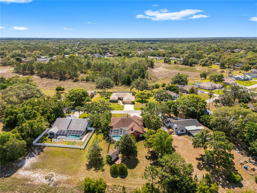 3051 Waterfall Drive Spring Hill, FL 34608 - Photo 69 of 74 an aerial view of residential houses with outdoor space and river