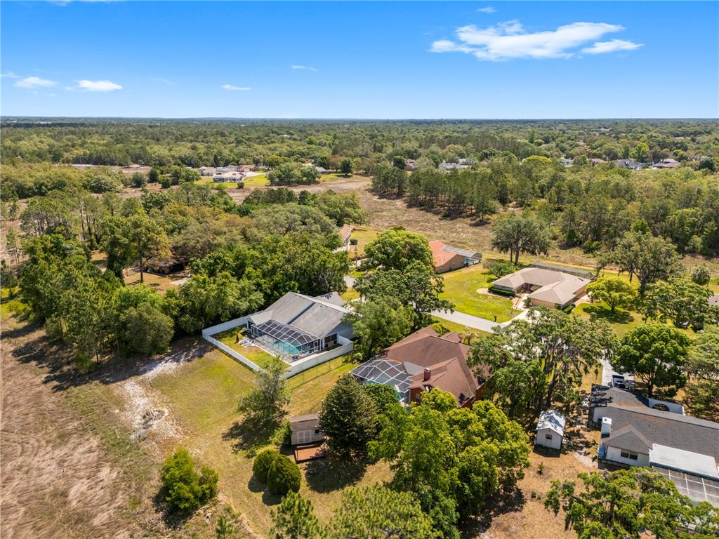3051 Waterfall Drive Spring Hill, FL 34608 - Photo 70 of 74 an aerial view of residential houses with outdoor space