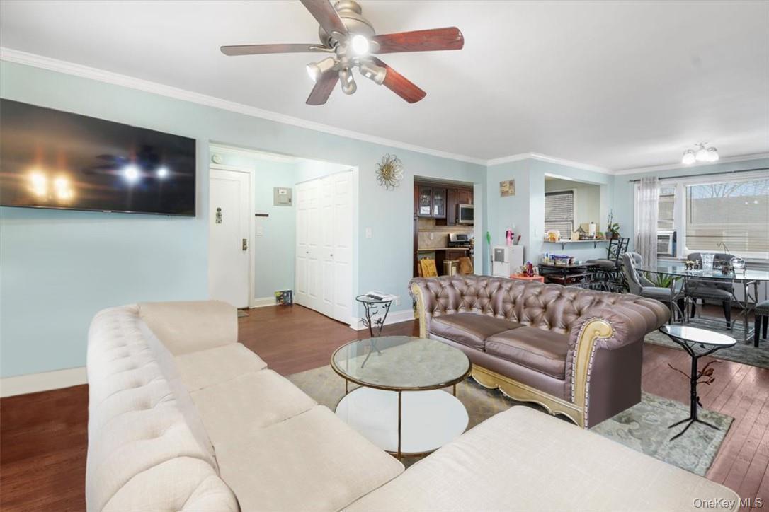 2 Soundview Avenue, Unit 2D White Plains, NY 10606 - Photo 4 of 16 a living room with furniture and a flat screen tv