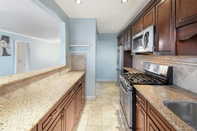 a kitchen with a stove and a sink