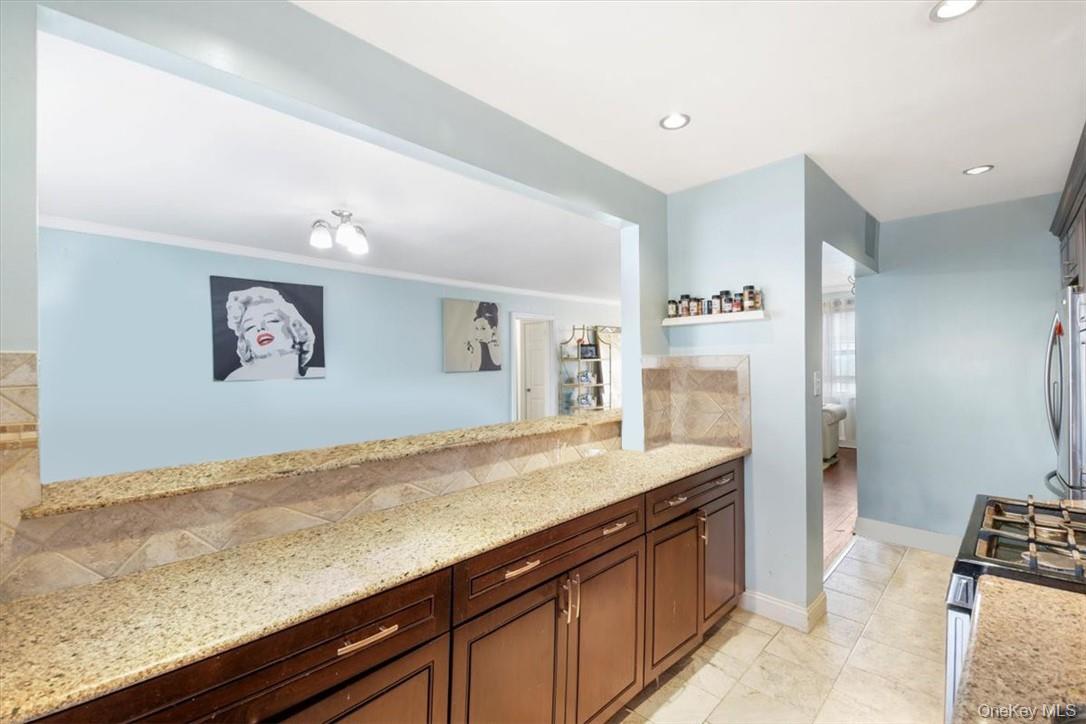 2 Soundview Avenue, Unit 2D White Plains, NY 10606 - Photo 10 of 16 a view of a kitchen with stainless steel appliances granite countertop a refrigerator and a sink