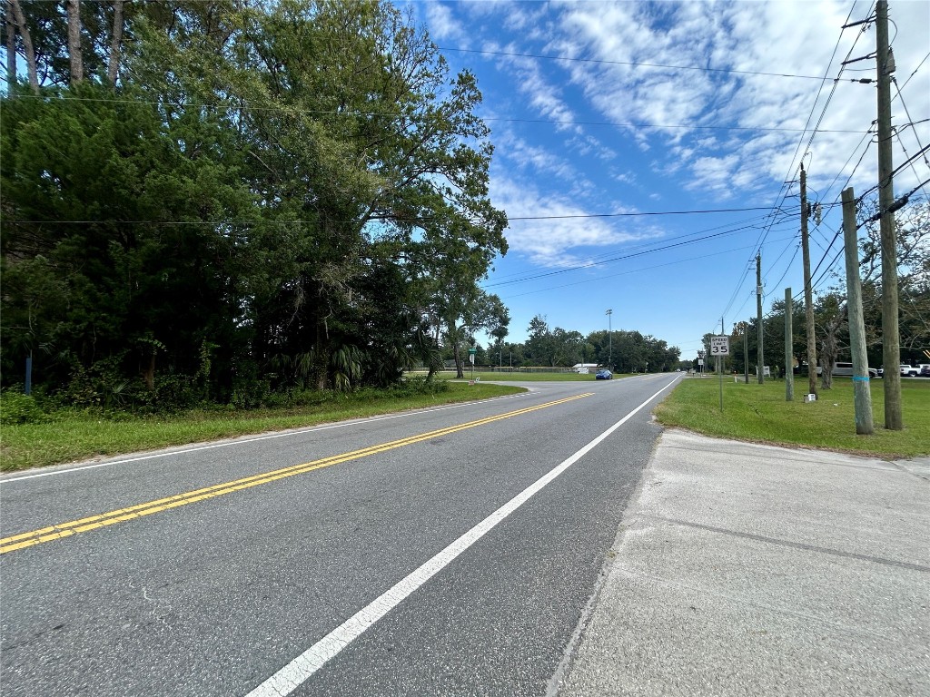 0 Goodbread Road Yulee, FL 32097 - Photo 12 of 19 a view of a road with a houses in the background