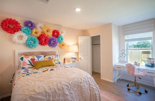 a bedroom with a bed and a window