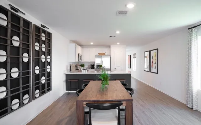 a kitchen with a table and chairs in it