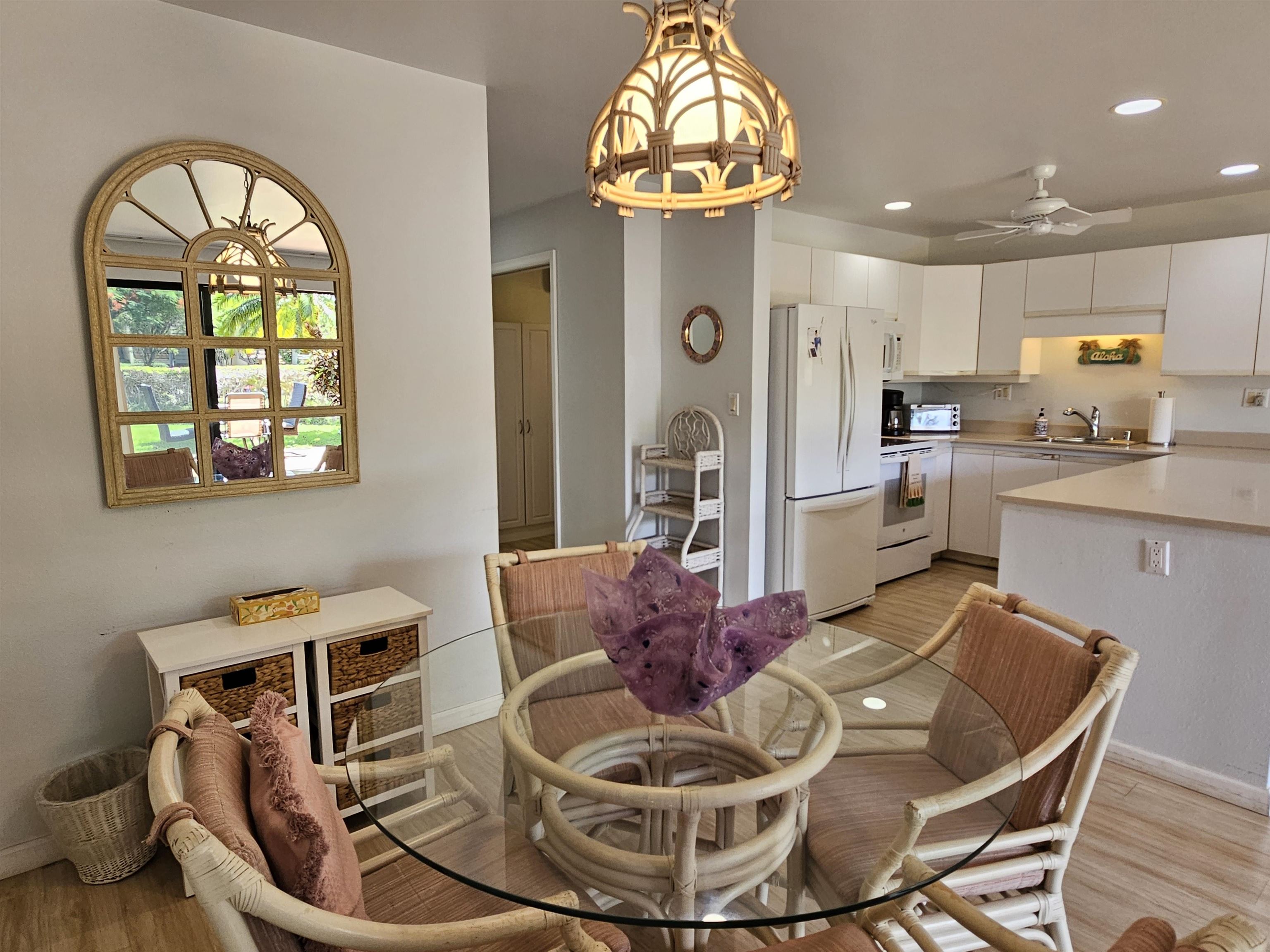 2777 South Kihei Road, Unit K107 Kihei, HI 96753 - Photo 12 of 50 a living room with furniture and a chandelier